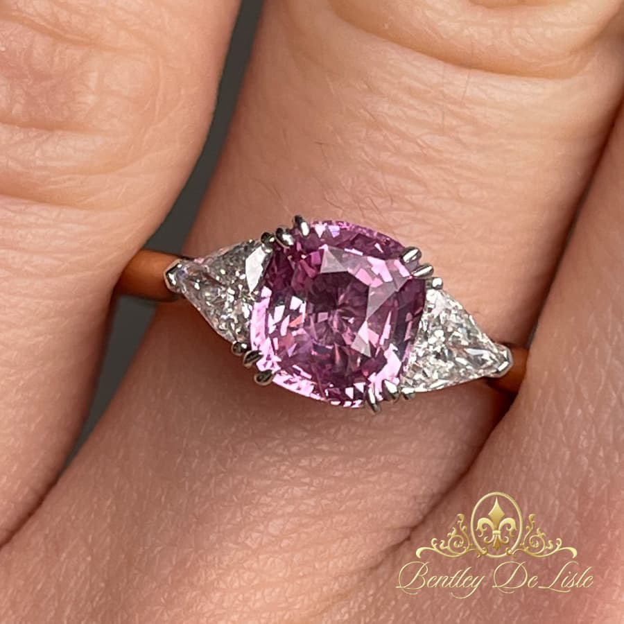 Padpardscha-sapphire-trilliant-cut-diamond-ring-hand-bentley-de-lisle