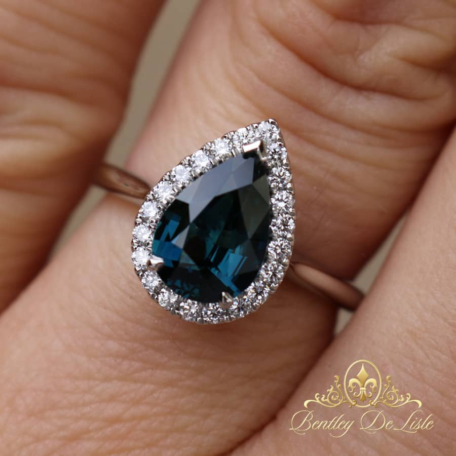Teal sapphire halo ring